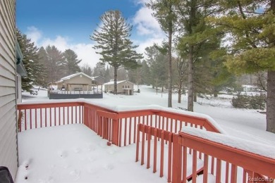 Welcome to this inviting raised ranch style home nestled within on Lost Lake Woods Club in Michigan - for sale on GolfHomes.com, golf home, golf lot