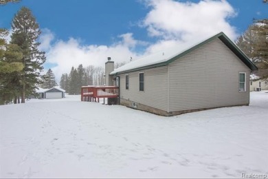 Welcome to this inviting raised ranch style home nestled within on Lost Lake Woods Club in Michigan - for sale on GolfHomes.com, golf home, golf lot