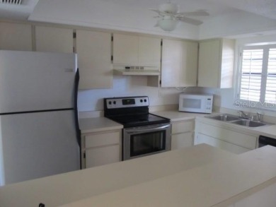 Located in the middle of just about anything you could need on Capri Isle Golf Club in Florida - for sale on GolfHomes.com, golf home, golf lot