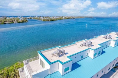 Awaken to sunny, sweeping views of the Intracoastal Waterway and on Lemon Bay Golf Club in Florida - for sale on GolfHomes.com, golf home, golf lot