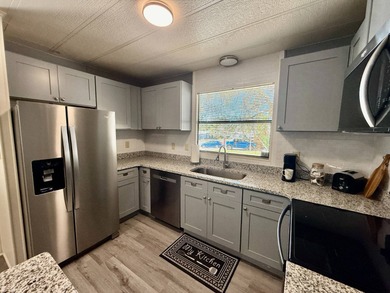 Home is located in Water Oak Country Club Estates, an active 55 on Water Oak Country Club Estates in Florida - for sale on GolfHomes.com, golf home, golf lot