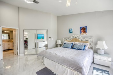 Enjoy beautiful lake views from one of the largest 3 bedroom on PGA National Golf Club in Florida - for sale on GolfHomes.com, golf home, golf lot