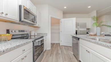 This home has 2 bedrooms and a flex room with french doors on Brunswick Plantation and Golf Resorts in North Carolina - for sale on GolfHomes.com, golf home, golf lot
