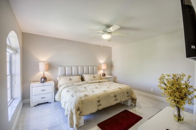 Enjoy beautiful lake views from one of the largest 3 bedroom on PGA National Golf Club in Florida - for sale on GolfHomes.com, golf home, golf lot