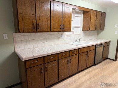 Beautifully Maintained Brick Ranch - Move-In Ready with timeless on The Olde Course At Loveland in Colorado - for sale on GolfHomes.com, golf home, golf lot