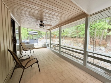 Enclosed glass sunroom offers year-round enjoyment from this on Cortez Golf Course in Arkansas - for sale on GolfHomes.com, golf home, golf lot