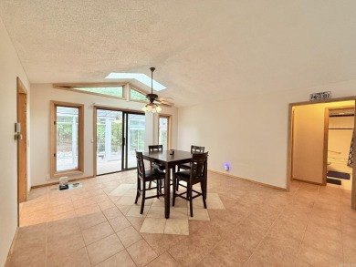 Enclosed glass sunroom offers year-round enjoyment from this on Cortez Golf Course in Arkansas - for sale on GolfHomes.com, golf home, golf lot