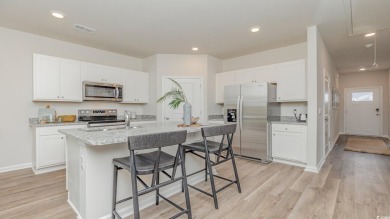 This home features 2 bedrooms and a flex room with french doors on Brunswick Plantation and Golf Resorts in North Carolina - for sale on GolfHomes.com, golf home, golf lot