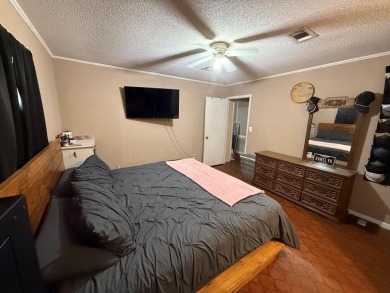 This home features a spacious layout with covered front and back on The Kings Arrow Ranch in Mississippi - for sale on GolfHomes.com, golf home, golf lot