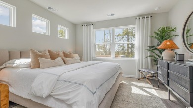 This home features 2 bedrooms and a flex room with french doors on Brunswick Plantation and Golf Resorts in North Carolina - for sale on GolfHomes.com, golf home, golf lot