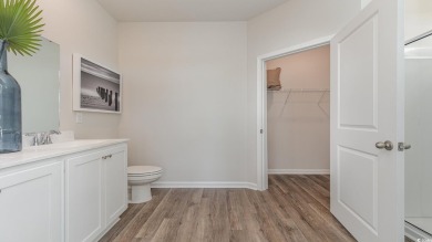 This home features 2 bedrooms and a flex room with french doors on Brunswick Plantation and Golf Resorts in North Carolina - for sale on GolfHomes.com, golf home, golf lot