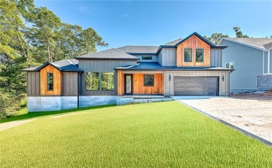 Welcome home to stunning new construction in Bella Vista. This on Bella Vista - Metfield Golf Complex and Country Club in Arkansas - for sale on GolfHomes.com, golf home, golf lot