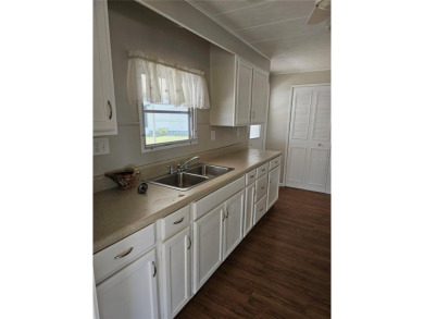 This home is seeking someone to complete the repairs and restore on Pelican Pointe Golf and Country Club in Florida - for sale on GolfHomes.com, golf home, golf lot