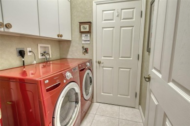Under contract-accepting backup offers. This spacious lakefront on University Park Country Club in Florida - for sale on GolfHomes.com, golf home, golf lot