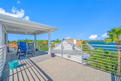 Welcome to this exceptional elvated Key West style 4-bedroom on Pasadena Yacht and Country Club in Florida - for sale on GolfHomes.com, golf home, golf lot