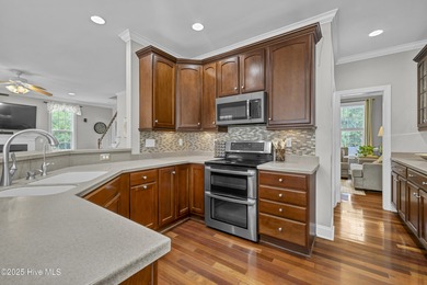 Tucked away on 1.49 private acres, this William Poole-designed on Olde Point Golf and Country Club in North Carolina - for sale on GolfHomes.com, golf home, golf lot