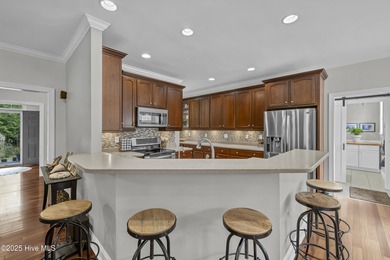 Tucked away on 1.49 private acres, this William Poole-designed on Olde Point Golf and Country Club in North Carolina - for sale on GolfHomes.com, golf home, golf lot