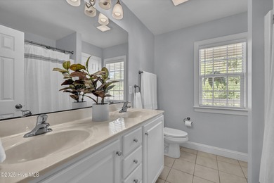 Tucked away on 1.49 private acres, this William Poole-designed on Olde Point Golf and Country Club in North Carolina - for sale on GolfHomes.com, golf home, golf lot