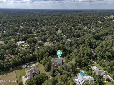 Tucked away on 1.49 private acres, this William Poole-designed on Olde Point Golf and Country Club in North Carolina - for sale on GolfHomes.com, golf home, golf lot