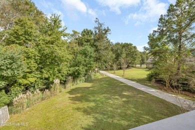 Tucked away on 1.49 private acres, this William Poole-designed on Olde Point Golf and Country Club in North Carolina - for sale on GolfHomes.com, golf home, golf lot