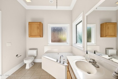 Welcome to 6516 Koula Drive, a peaceful retreat tucked away in on Diamondhead Country Club in Mississippi - for sale on GolfHomes.com, golf home, golf lot