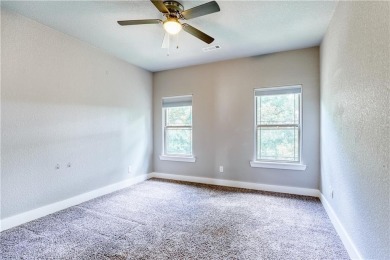 Welcome to your spacious retreat near Sugar Creek Golf Course! on Big Sugar Golf Club in Arkansas - for sale on GolfHomes.com, golf home, golf lot