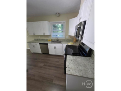 Welcome to this spacious 4-bedroom, 3-bathroom brick split-level on University of Georgia Golf Course in Georgia - for sale on GolfHomes.com, golf home, golf lot