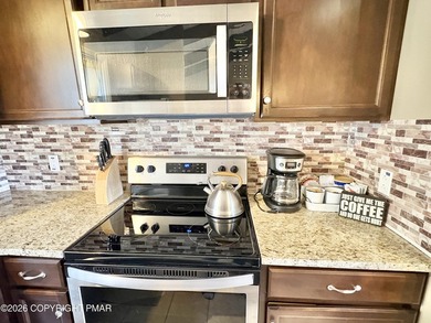 Rare availability in the Poconos. Step into your fully furnished on Split Rock Resort and Country Club in Pennsylvania - for sale on GolfHomes.com, golf home, golf lot