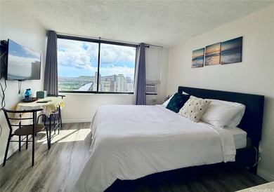 Stunning high floor one bedroom condo at Waikiki Hawaiian on Ala Wai Golf Course in Hawaii - for sale on GolfHomes.com, golf home, golf lot