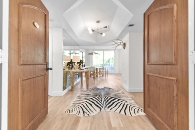 Step into this exquisitely reimagined condo in the prestigious on Jonathans Landing Golf Club in Florida - for sale on GolfHomes.com, golf home, golf lot