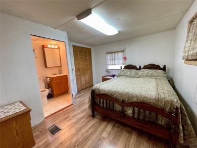 Discover this charming 3-bedroom, 2-bathroom singlewide home on on Nocona Hills Golf Course in Texas - for sale on GolfHomes.com, golf home, golf lot