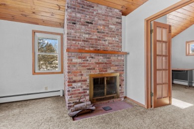 This charming 1.5-story home offers water access to Lake Iola on Glacier Wood Golf Club in Wisconsin - for sale on GolfHomes.com, golf home, golf lot