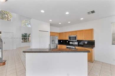 Beautifully maintained 4/3 bath golf course residence in a on Palm-Aire Country Club and Resort - The Oaks in Florida - for sale on GolfHomes.com, golf home, golf lot