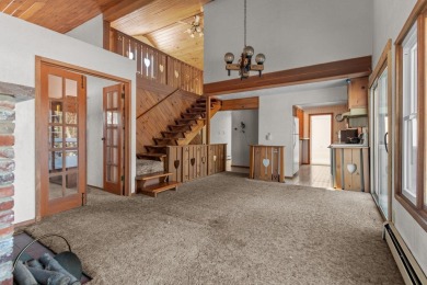 This charming 1.5-story home offers water access to Lake Iola on Glacier Wood Golf Club in Wisconsin - for sale on GolfHomes.com, golf home, golf lot