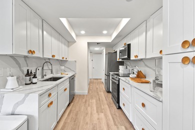 Step into this exquisitely reimagined condo in the prestigious on Jonathans Landing Golf Club in Florida - for sale on GolfHomes.com, golf home, golf lot