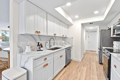 Step into this exquisitely reimagined condo in the prestigious on Jonathans Landing Golf Club in Florida - for sale on GolfHomes.com, golf home, golf lot