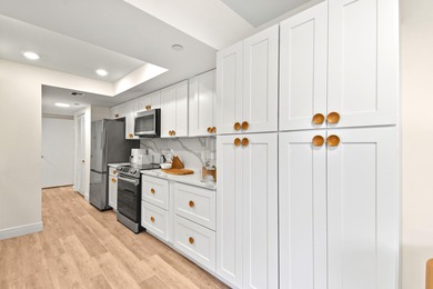 Step into this exquisitely reimagined condo in the prestigious on Jonathans Landing Golf Club in Florida - for sale on GolfHomes.com, golf home, golf lot