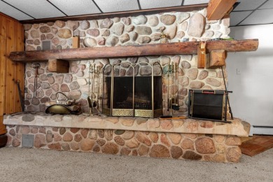 This charming 1.5-story home offers water access to Lake Iola on Glacier Wood Golf Club in Wisconsin - for sale on GolfHomes.com, golf home, golf lot