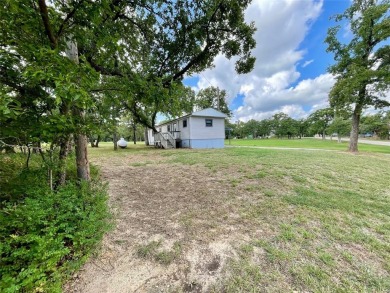 Discover this charming 3-bedroom, 2-bathroom singlewide home on on Nocona Hills Golf Course in Texas - for sale on GolfHomes.com, golf home, golf lot