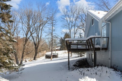 This charming 1.5-story home offers water access to Lake Iola on Glacier Wood Golf Club in Wisconsin - for sale on GolfHomes.com, golf home, golf lot