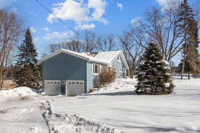 This charming 1.5-story home offers water access to Lake Iola on Glacier Wood Golf Club in Wisconsin - for sale on GolfHomes.com, golf home, golf lot