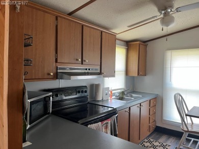 MOVE-IN READY, FURNISHED PROPERTY FOR LESS THAN $100K.  This on River Ridge Golf Club in Virginia - for sale on GolfHomes.com, golf home, golf lot