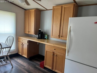 MOVE-IN READY, FURNISHED PROPERTY FOR LESS THAN $100K.  This on River Ridge Golf Club in Virginia - for sale on GolfHomes.com, golf home, golf lot