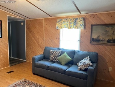 MOVE-IN READY, FURNISHED PROPERTY FOR LESS THAN $100K.  This on River Ridge Golf Club in Virginia - for sale on GolfHomes.com, golf home, golf lot