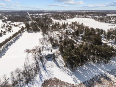 This charming 1.5-story home offers water access to Lake Iola on Glacier Wood Golf Club in Wisconsin - for sale on GolfHomes.com, golf home, golf lot