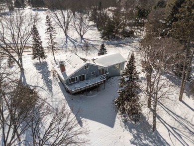 This charming 1.5-story home offers water access to Lake Iola on Glacier Wood Golf Club in Wisconsin - for sale on GolfHomes.com, golf home, golf lot