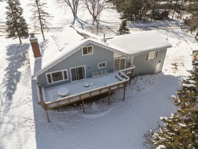 This charming 1.5-story home offers water access to Lake Iola on Glacier Wood Golf Club in Wisconsin - for sale on GolfHomes.com, golf home, golf lot