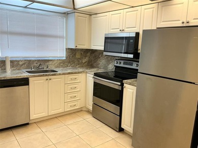 Discover exceptional value & endless potential in this first on Sunrise Lakes Phase III in Florida - for sale on GolfHomes.com, golf home, golf lot