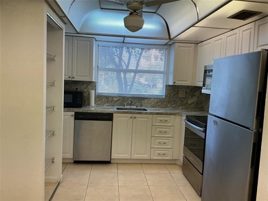 Discover exceptional value & endless potential in this first on Sunrise Lakes Phase III in Florida - for sale on GolfHomes.com, golf home, golf lot