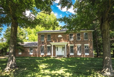 This stunning 2-story home offers 4 bedrooms, 2 full baths, and on Oak Meadow Country Club in Missouri - for sale on GolfHomes.com, golf home, golf lot